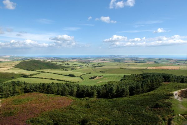 Overlooking extensive farmland and out to sea