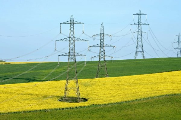 Arable land with electricity pylons crossing through